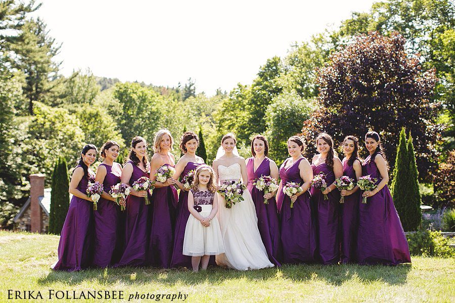 large bridal party in purple dresses