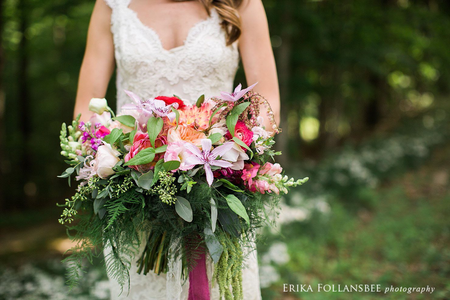 bride holding a large, colorful, free-form bouquet by Sorella Flower Company