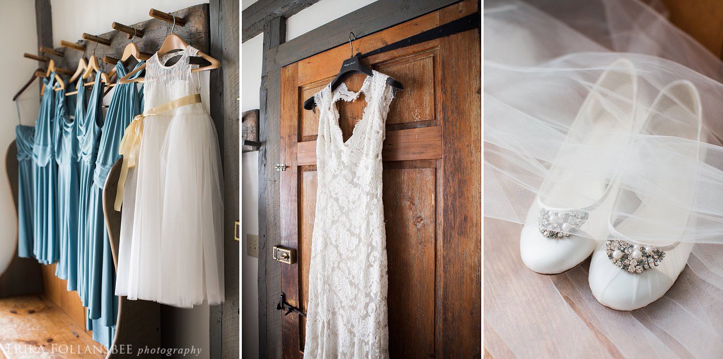 wedding gown and bridesmaids dresses hanging in a rustic toned room