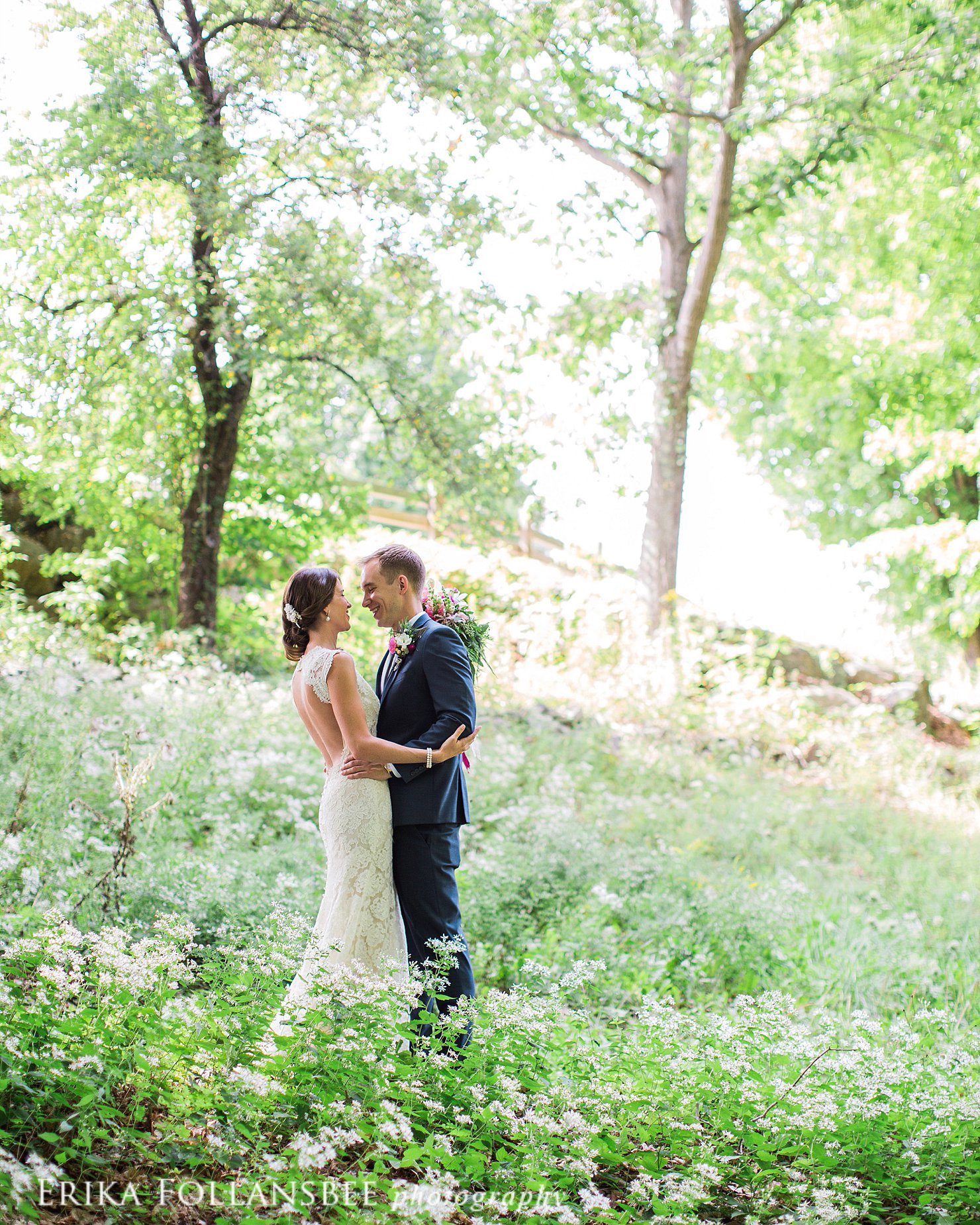 wedding portrait in the woods surrounded by little white flowers | NH Wedding Photographer