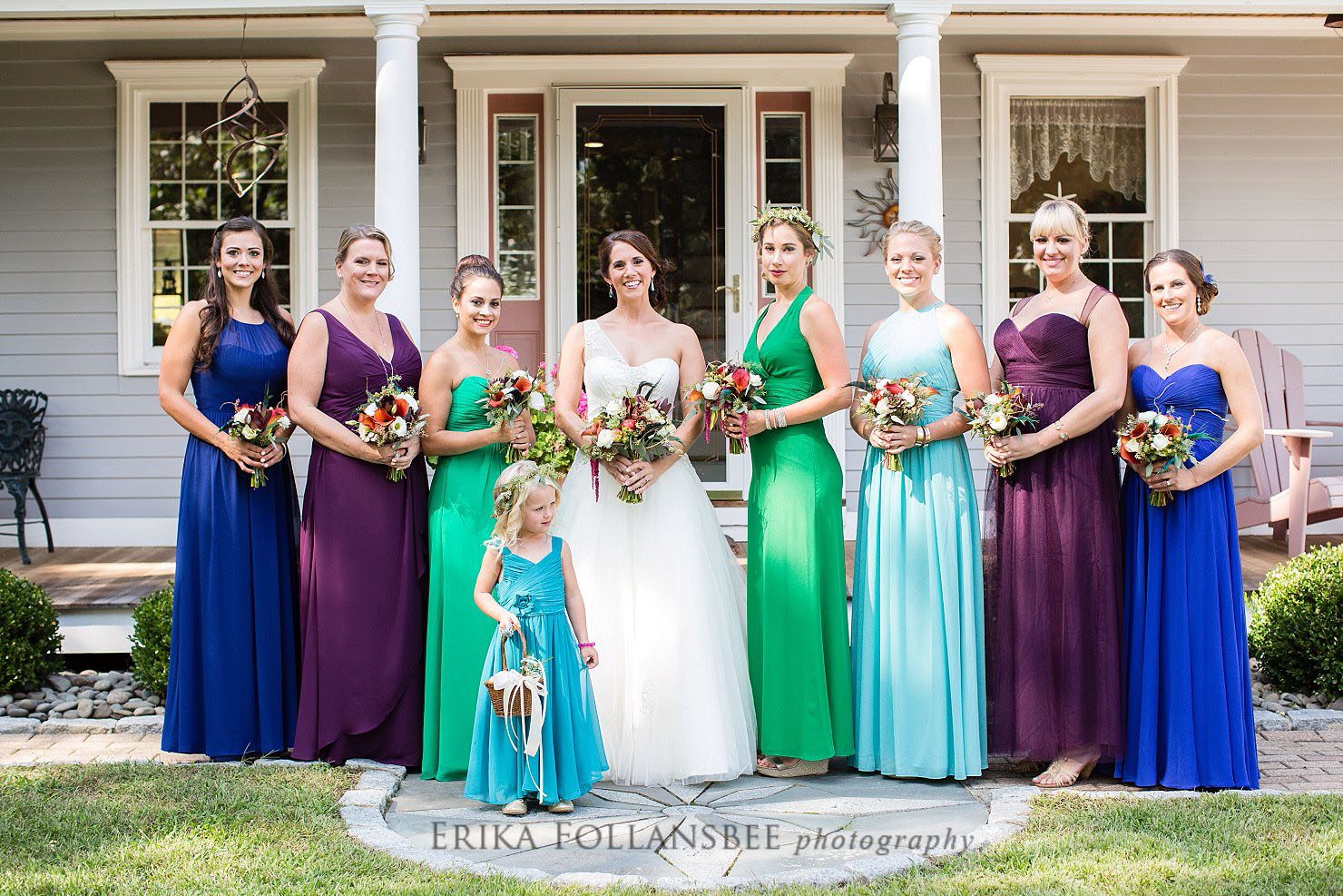 bridesmaids in peacock colored dresses