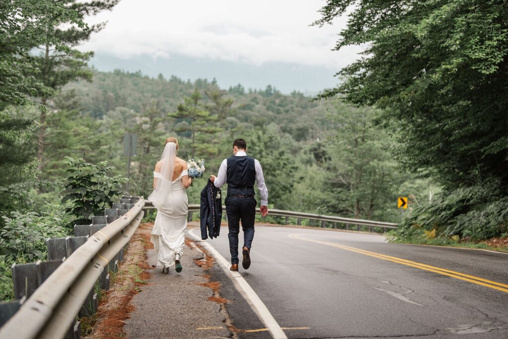 Bride and Groom walking from Jackson Falls to their wedding at the Wentworth Inn